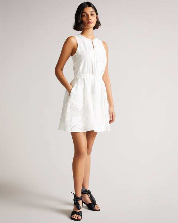 <P>Flippy Mini Dress With Neck Tie</P>